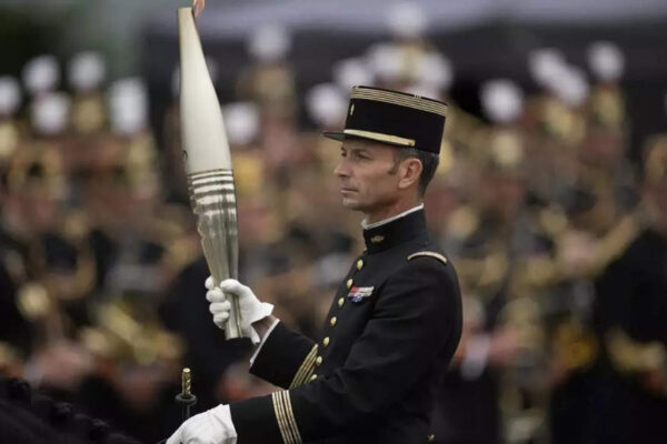 Olympic Torch Relay: France's Bastille Day parade meets the Olympic torch relay in an exceptional year